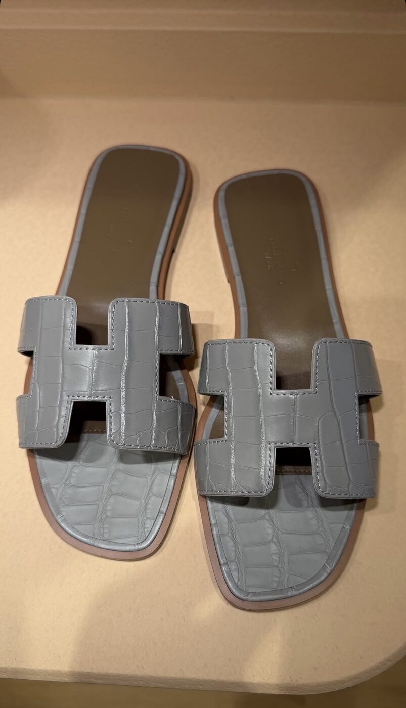 Hermès Oran sandals in grey embossed calfskin, a frequently requested sourcing piece